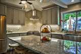 Dimensional geometric wall tile, Island Stone's Paragon Hex, used as a full kitchen backsplash