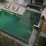 Raised pool with Sukabumi stone tile and modern landscape